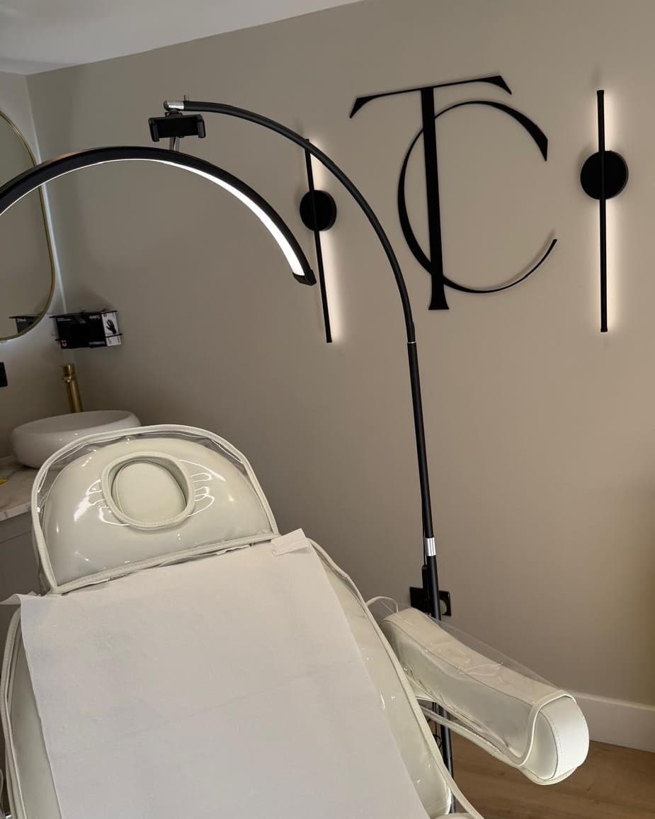 The treatment chair and TC monogram wall at The Clinic